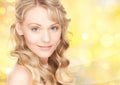 Beautiful young woman face over yellow lights Royalty Free Stock Photo