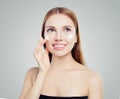 Beautiful young woman female model applying cosmetic cream treatment on her face on white background Royalty Free Stock Photo