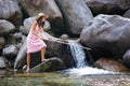 Beautiful young woman fishing in a river Royalty Free Stock Photo