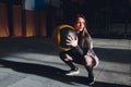 Beautiful young woman in fitness center doing pilates exercise with fitness ball. Healthy lifestyle concept. Royalty Free Stock Photo