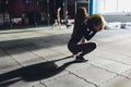 Beautiful young woman in fitness center doing pilates exercise with fitness ball. Healthy lifestyle concept. Royalty Free Stock Photo