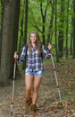 Stunning woman hiker in flannel with tekking poles Royalty Free Stock Photo