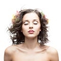 Beautiful young woman with flower in blowing hair Royalty Free Stock Photo