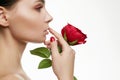 Beautiful Young Woman with Flower. Sensual Beauty Portrait of girl with Rose Flower