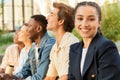 Beautiful young woman spending time with her friends multicultural students Royalty Free Stock Photo