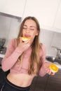 Beautiful young woman with fresh healthy oranges at kitchen Royalty Free Stock Photo