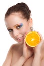 Beautiful young woman with fresh orange. Royalty Free Stock Photo