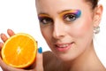 Beautiful young woman with fresh orange. Royalty Free Stock Photo