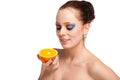 Beautiful young woman with fresh orange. Royalty Free Stock Photo