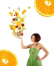 Beautiful young woman with a fruit salad Royalty Free Stock Photo