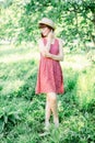 Beautiful young woman in the garden. A girl in a straw hat Royalty Free Stock Photo