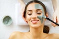 Beautiful Young Woman Getting a Face Treatment at Beauty Salon.Skin and care. Beautiful Woman Lying With Face Mask. Pure and Beaut Royalty Free Stock Photo