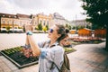 Beautiful young woman girl doing photographing sights on a smart Royalty Free Stock Photo