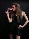 Beautiful young woman with a glass of red wine. Royalty Free Stock Photo