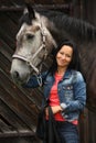 Beautiful young woman and gray horse portrait Royalty Free Stock Photo