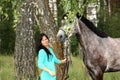 Beautiful young woman and gray horse portrait Royalty Free Stock Photo