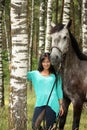 Beautiful young woman and gray horse portrait Royalty Free Stock Photo