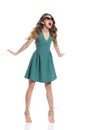 Beautiful Young Woman In Green Mini Dress, Sunglasses And High Heels Is Shouting Royalty Free Stock Photo