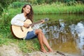 Beautiful young woman with guitar Royalty Free Stock Photo