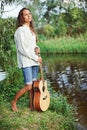 Beautiful young woman with guitar Royalty Free Stock Photo