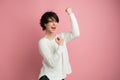 Beautiful young woman happy and excited expressing winning gesture. Successful and celebrating victory, triumphant Royalty Free Stock Photo