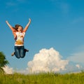 Beautiful young woman happy jumping on blue sky Royalty Free Stock Photo