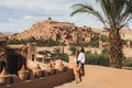 Beautiful young woman happy to travel in Morocco. Ait-Ben-Haddou on background Royalty Free Stock Photo