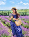 Beautiful young woman in hat on lavender field Royalty Free Stock Photo