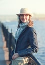 Beautiful young woman in hat and scarf in the city Royalty Free Stock Photo