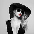 Beautiful young woman in hat and sunglasses Royalty Free Stock Photo