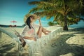 Beautiful young woman with hat on white beach, beautiful scenery with woman in maldives, tropical paradise
