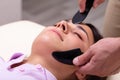 Woman Receiving Gua Sha Acupuncture Treatment On Her Face Royalty Free Stock Photo