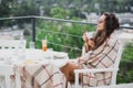 Beautiful young woman having breakfast in a cafe Royalty Free Stock Photo