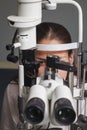 Beautiful young woman having eye test at the optometrist Royalty Free Stock Photo