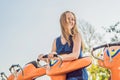 Beautiful, young woman having fun at an amusement park Royalty Free Stock Photo