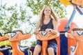 Beautiful, young woman having fun at an amusement park Royalty Free Stock Photo