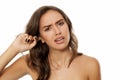 Woman with itchy ear Royalty Free Stock Photo