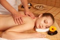 Beautiful young woman having a massage treatment in spa salon - wellness Royalty Free Stock Photo