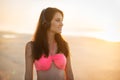 Beautiful young woman in headphones walking on the beach and enjoing of music listening Royalty Free Stock Photo