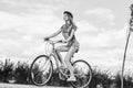 Beautiful young woman with her bicycle at the park Royalty Free Stock Photo
