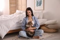 Beautiful young woman with her cute cat on floor. Fluffy pet Royalty Free Stock Photo