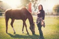 Beautiful young woman with her horse Royalty Free Stock Photo