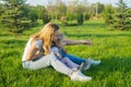 Beautiful young woman and her small daughter sitting Royalty Free Stock Photo