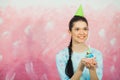 Beautiful young woman holding birthday cupcake and making wish Royalty Free Stock Photo