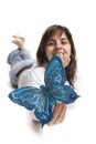 Beautiful young woman holding blue butterfly Royalty Free Stock Photo