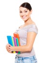 Beautiful young woman holding books Royalty Free Stock Photo