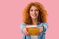 Young woman holding books isolated on pink Royalty Free Stock Photo