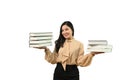 Beautiful young woman holding books standing isolated on white background. Education concept Royalty Free Stock Photo