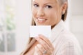 Beautiful young woman holding card Royalty Free Stock Photo