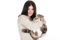 Beautiful young woman holding a cat, isolated against white background Royalty Free Stock Photo